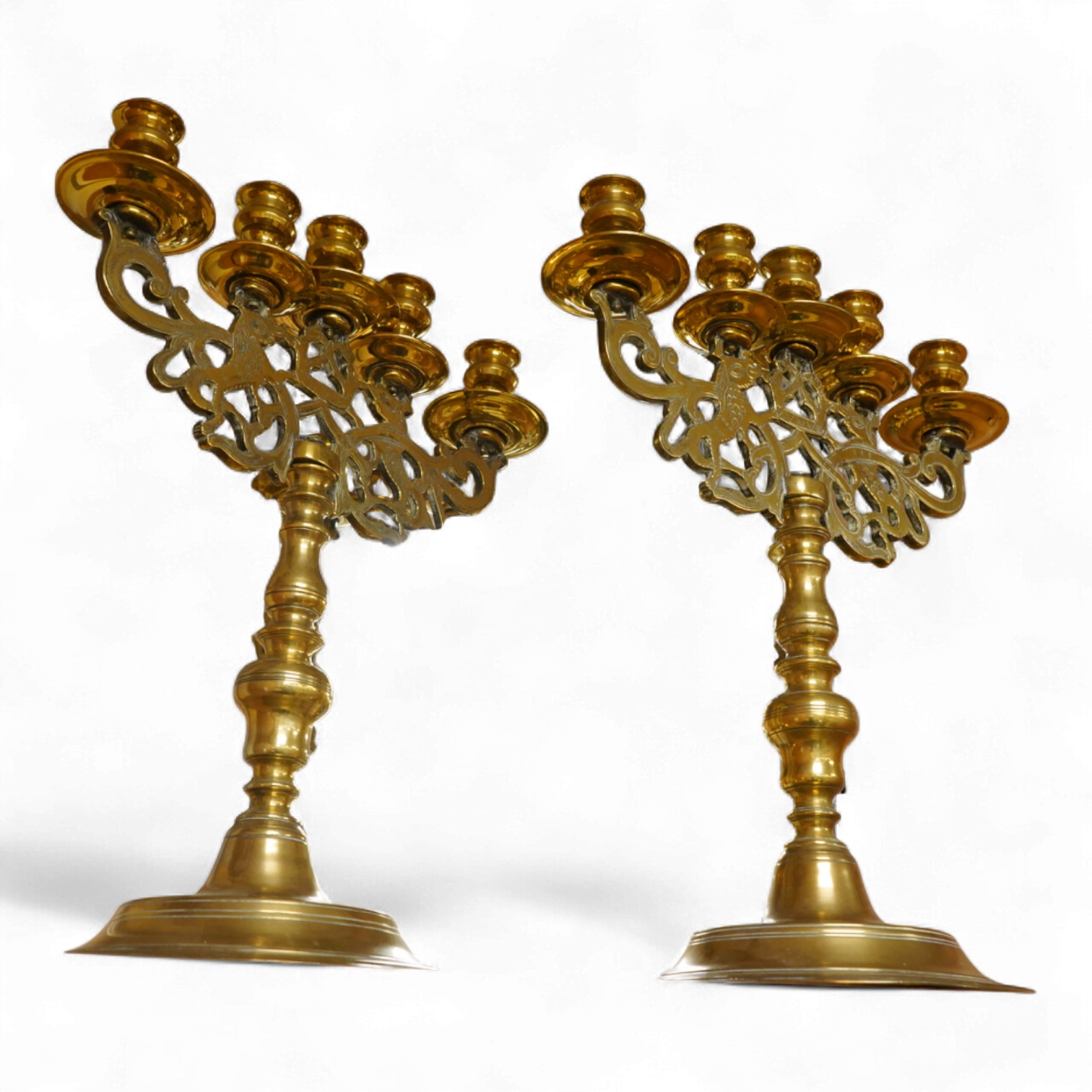 A pair of Juddah Sabbath five light brass candlesticks, 50cm high
